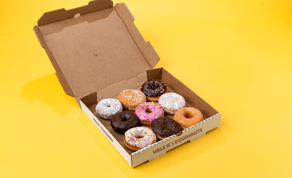 Holenonedoughnut Pizza box with 9 donuts from Hole n' 1 Doughnuts