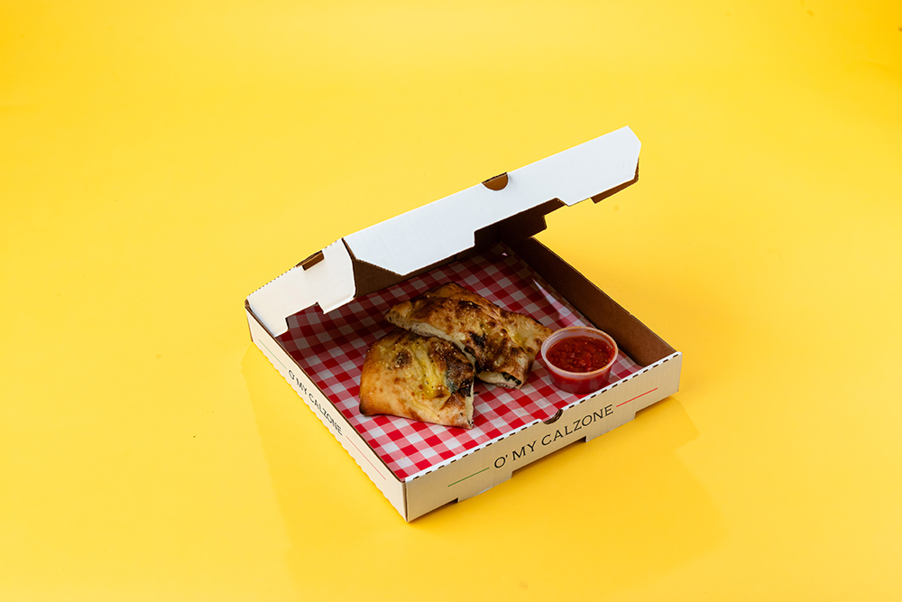 A calzone in a pizza box.