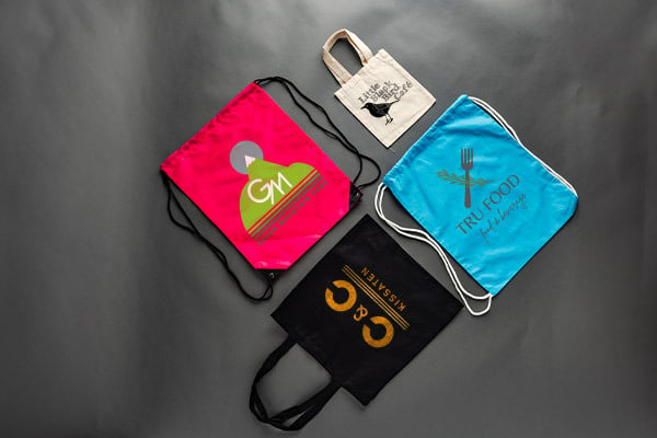 Reusable bags laying on a black background