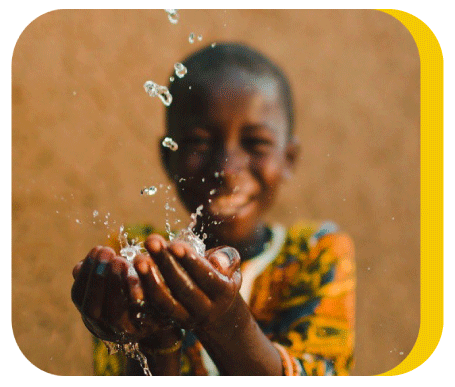 Water falls in a boy's hands