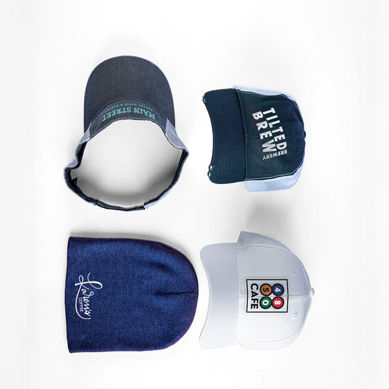 Custom printed hats, visor, and beanie displayed in a square